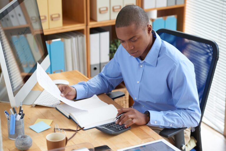 Accountant reviewing financial documents and BAS lodgement paperwork