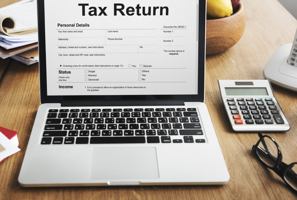 Income tax return form and financial documents showing Australian tax rates
