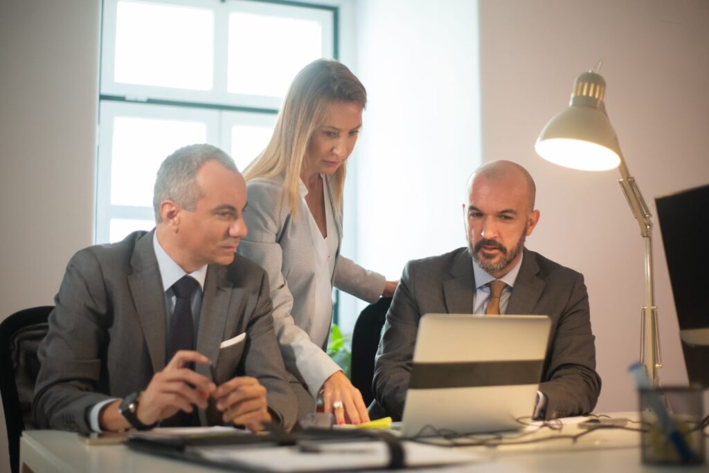 Business managers discussing financial analytics with a virtual CFO adviser